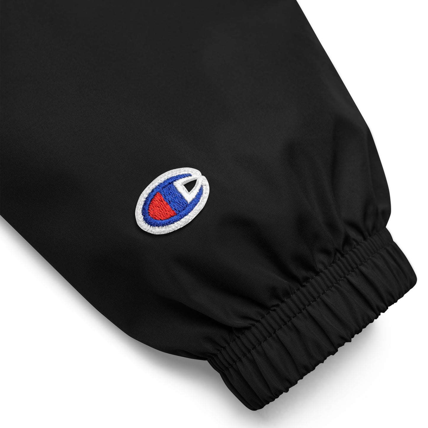 Sleeve detail view of black Hellbeing Embroidered Champion packable jacket