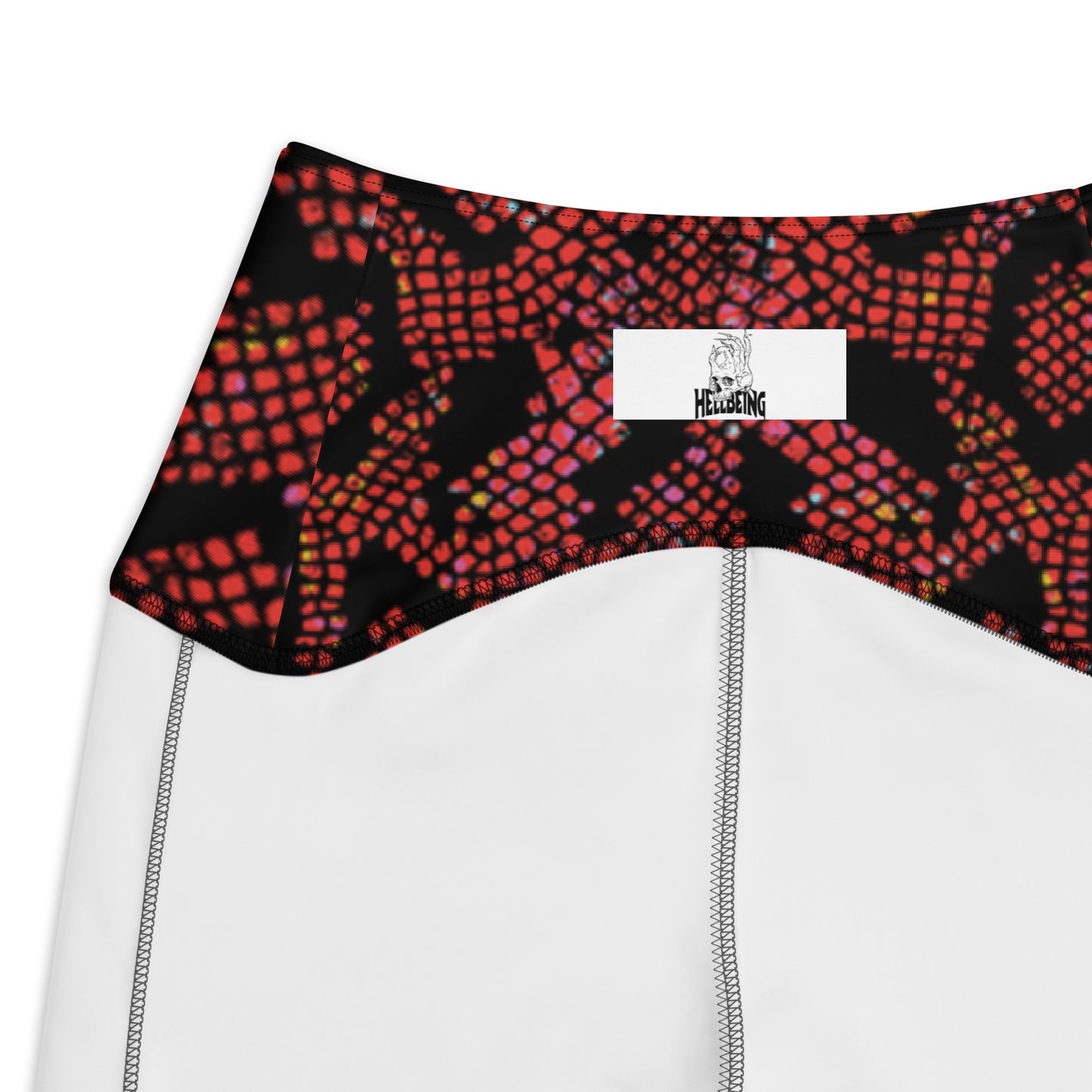 Inside tag view of the Hellbeing recycled crossover leggings in black and burgundy snakeskin