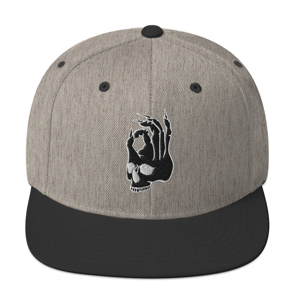Front view of the Hellbeing skull embroidered classic heather gray and black snapback hat