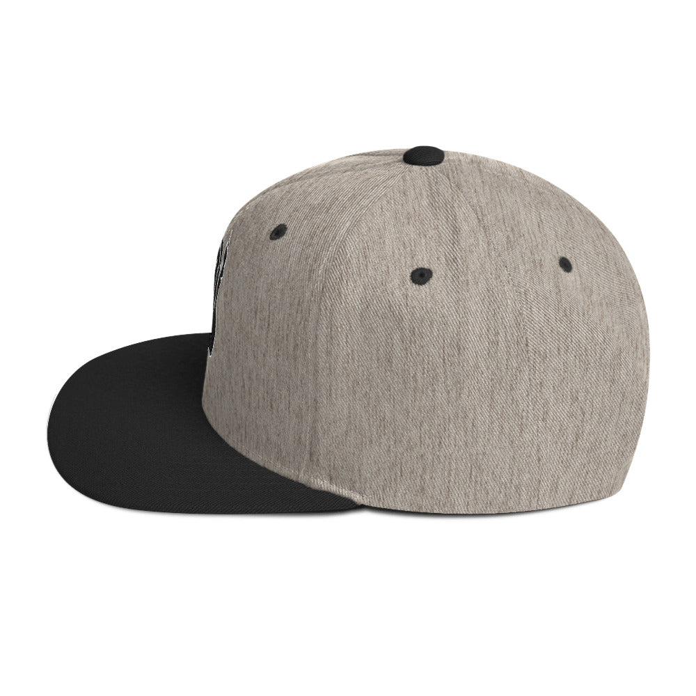 Left side view of the Hellbeing skull embroidered classic heather gray and black snapback hat