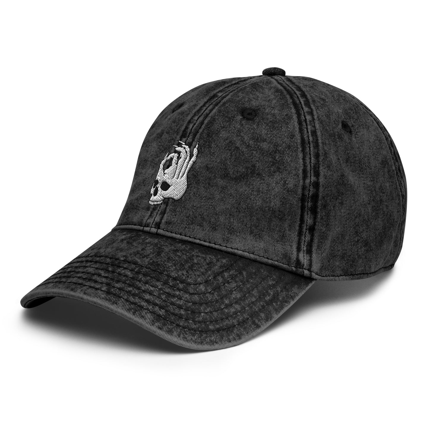 Front view of the Hellbeing skull embroidered vintage black cap