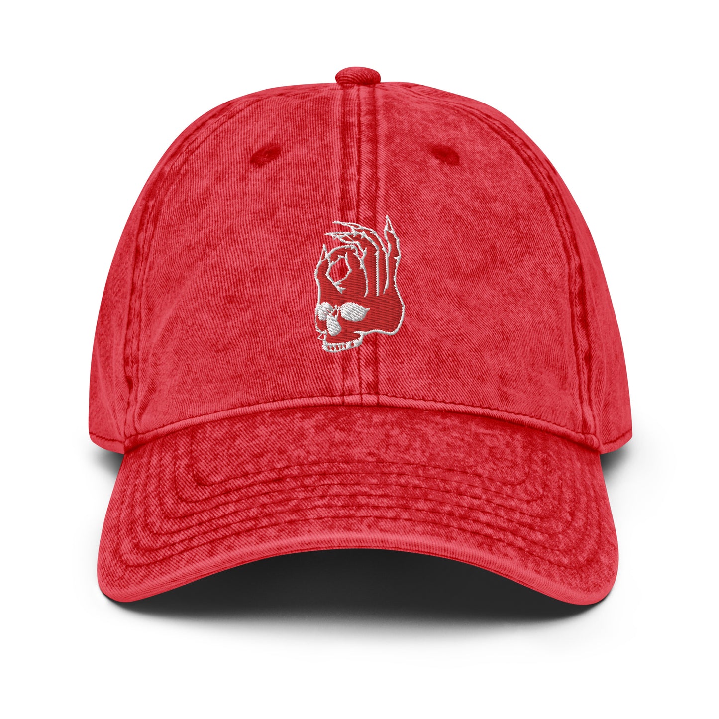 Front view of the Hellbeing skull embroidered vintage red cap