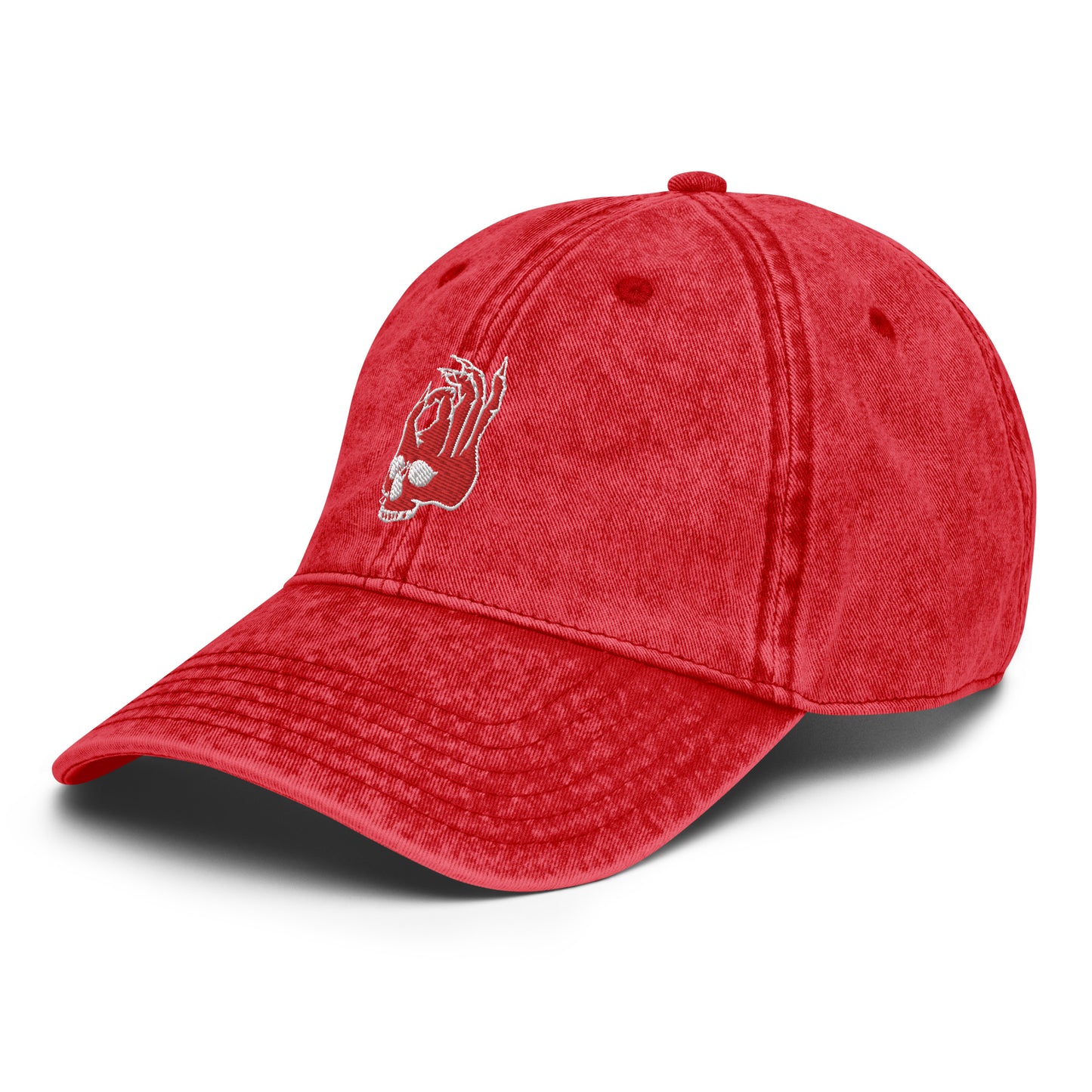 Front side view of the Hellbeing skull embroidered vintage red cap