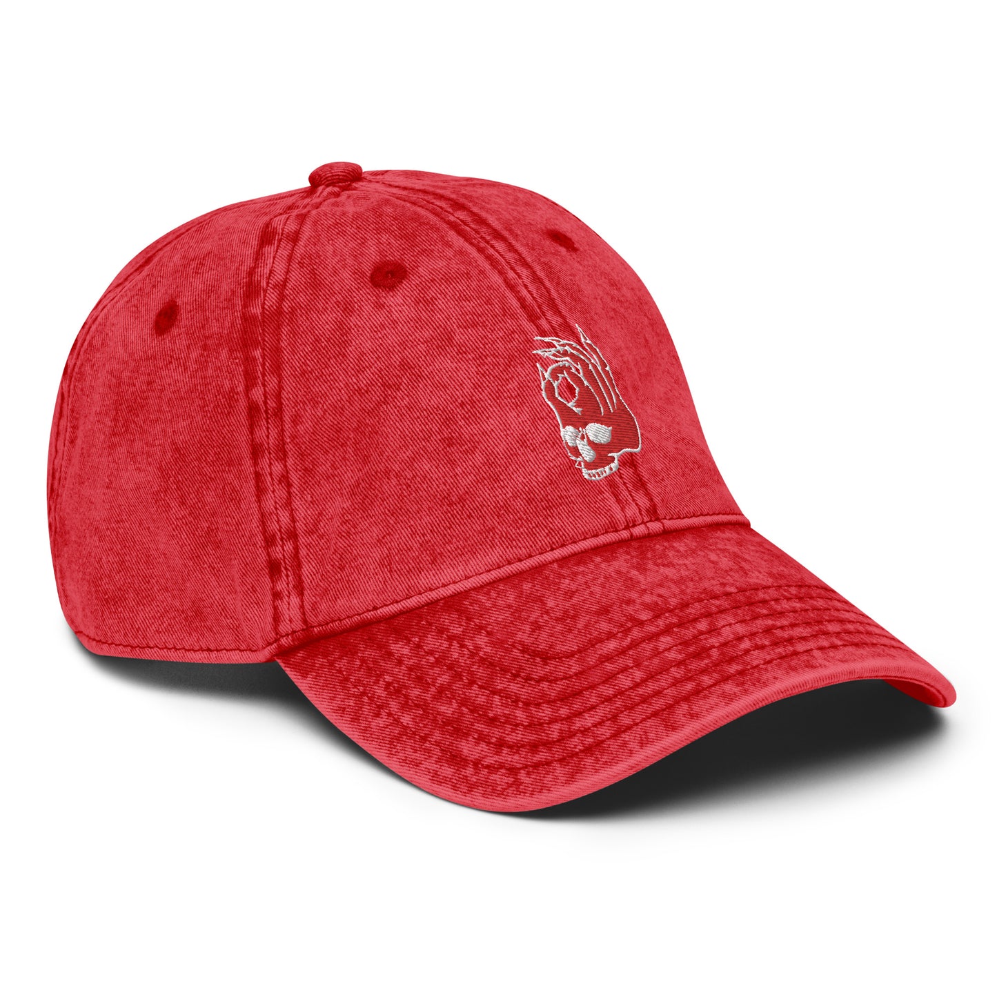Front left view of the Hellbeing skull embroidered vintage red cap