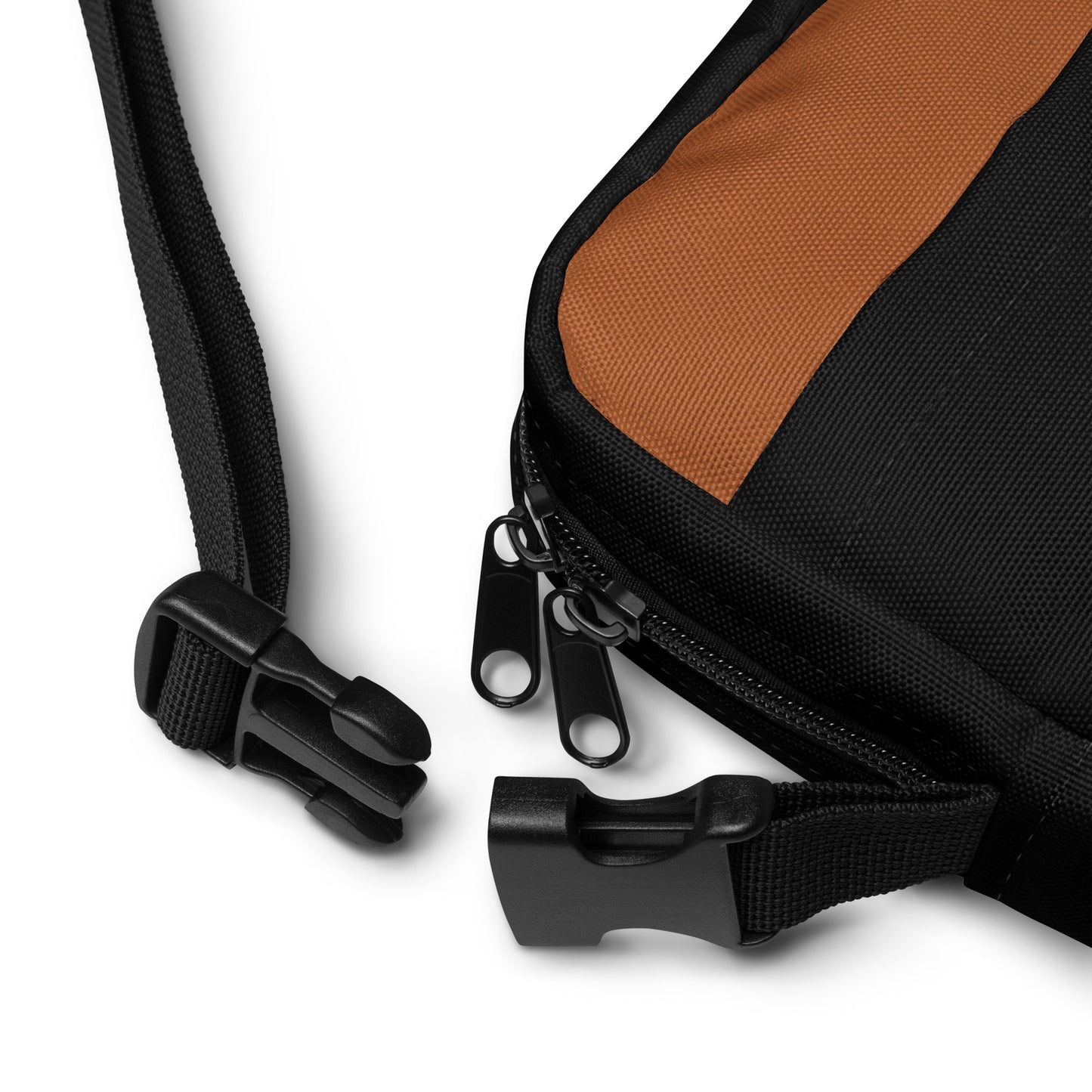 Zoomed in view of Hellbeing Brown and Black Crossbody utility bag straps and zipper