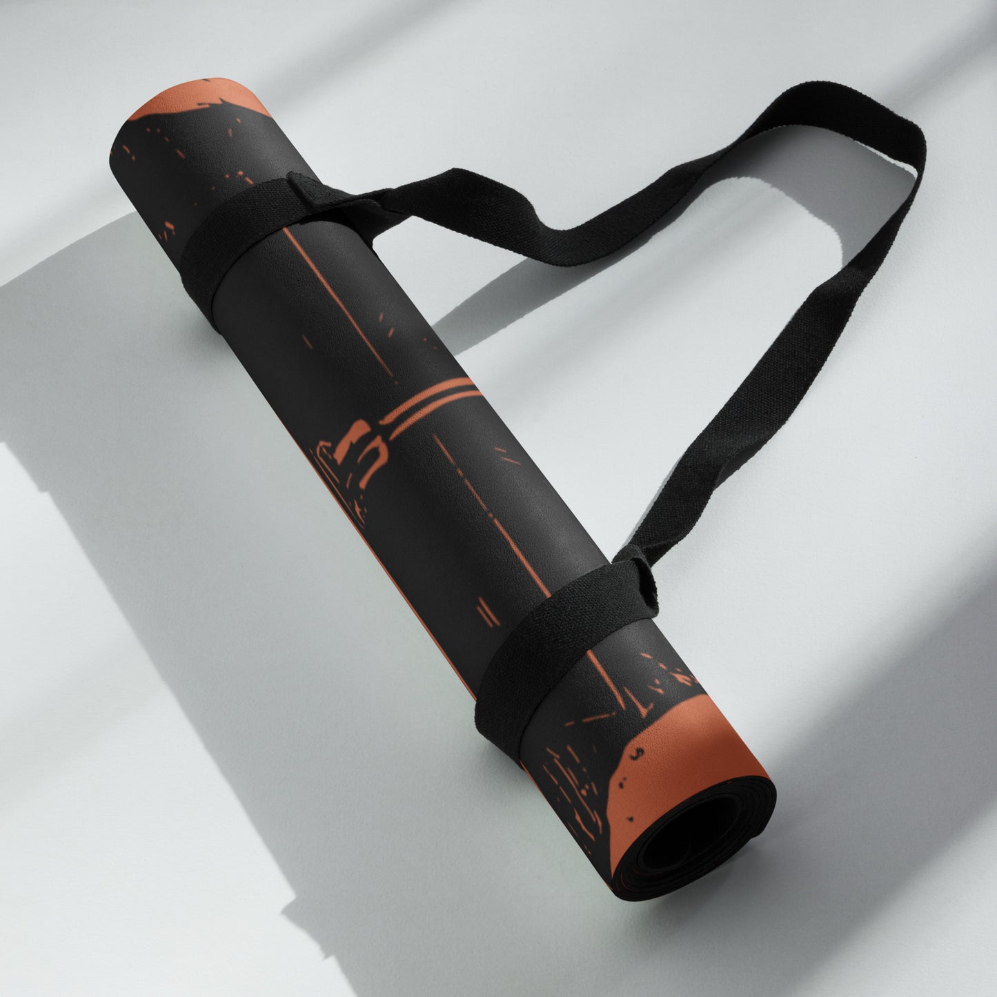 Zoomed in, rolled up view of the Hellbeing black and red Lucifer, rubber Yoga mat with an anti-slip rubber bottom and microsuede top.