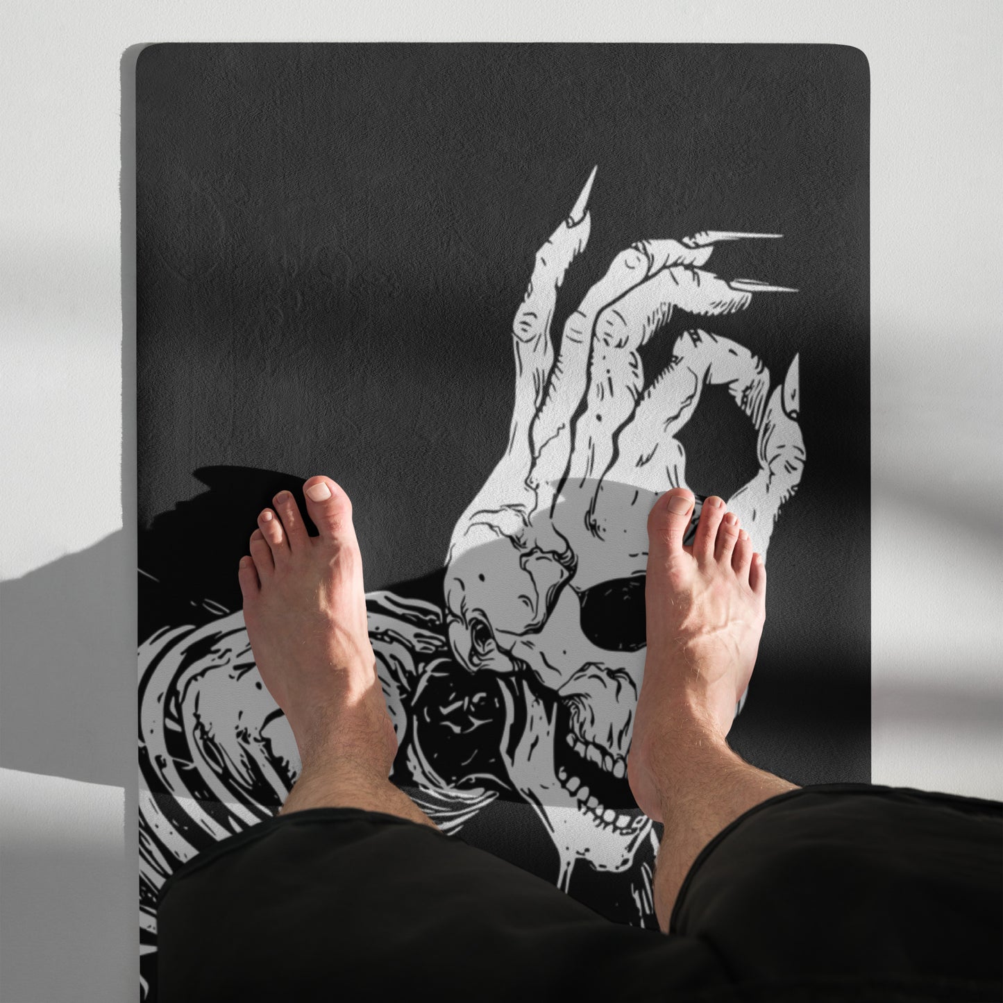 Standing view of the Hellbeing black and white Cycling rubber Yoga mat with an anti-slip rubber bottom and microsuede top.