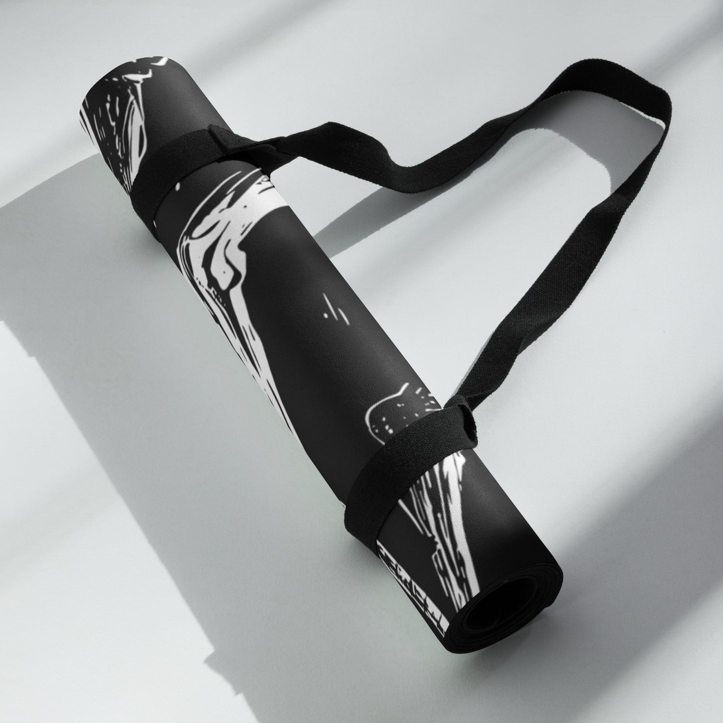 Rolled up view of the Hellbeing black and white Cycling rubber Yoga mat with an anti-slip rubber bottom and microsuede top.