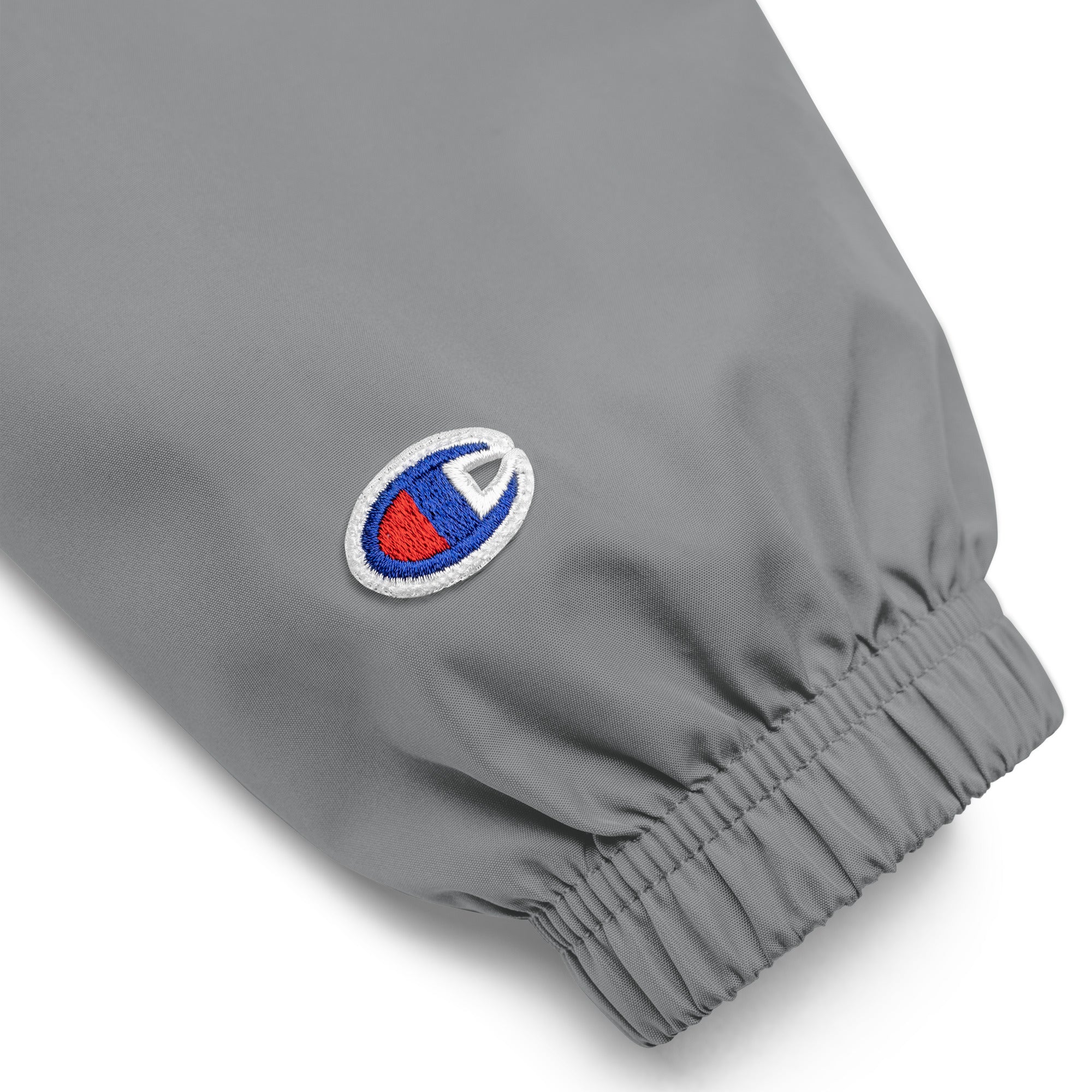 Hellbeing embroidered Champion packable jacket in gray, sleeve logo detail