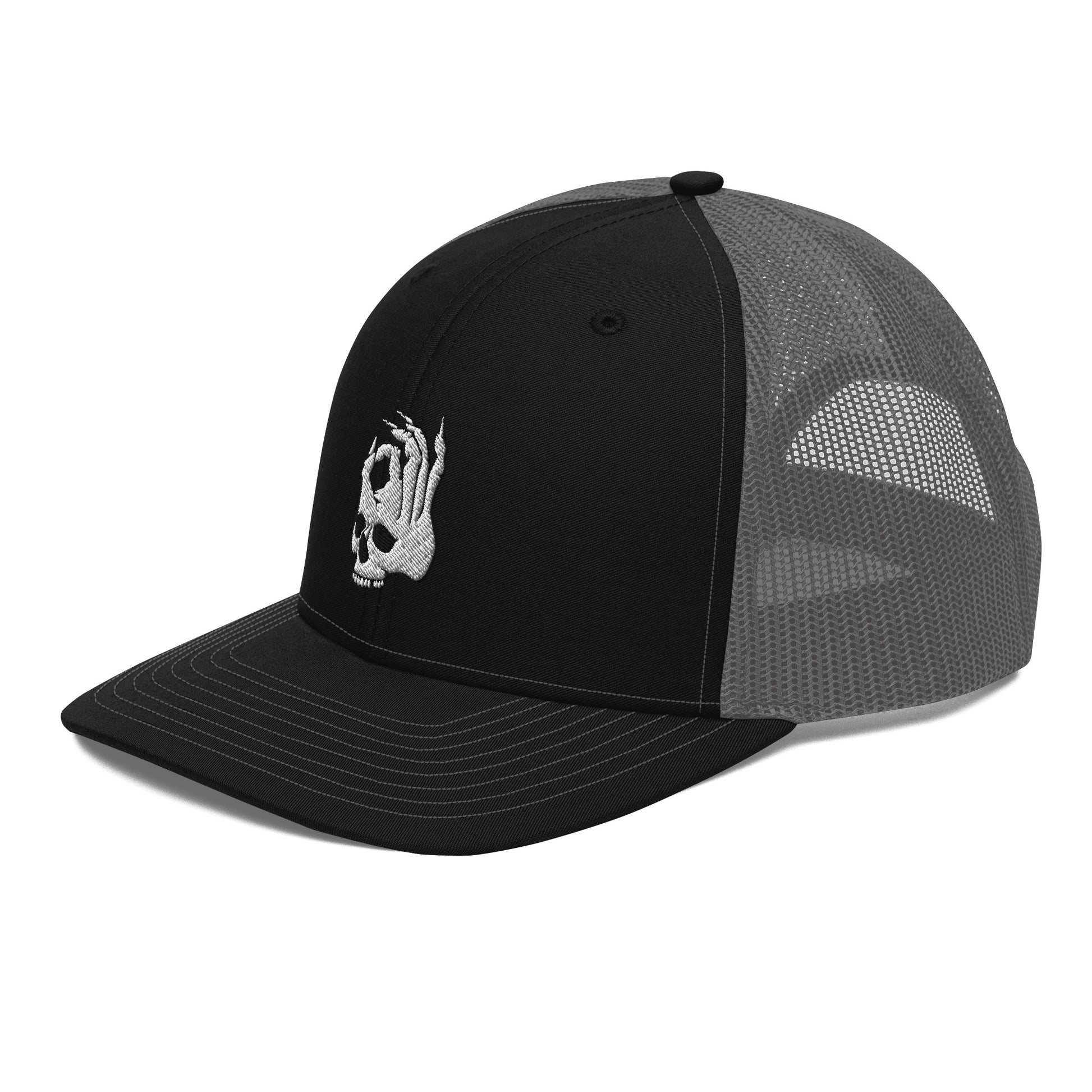 Hellbeing embroidered skull logo on a black and charcoal snapback trucker cap from a left front view angle