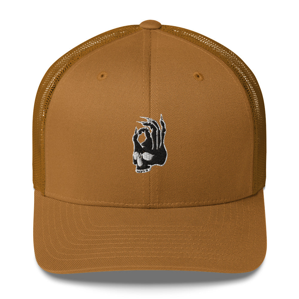 Front view of Hellbeing skull embroidered brown trucker hat