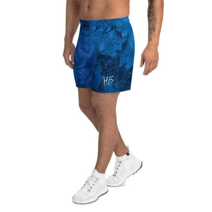 Hellbeing Bottom Line athletic long shorts in blue, left side view
