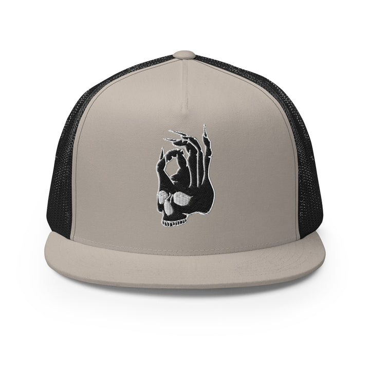 Front view of the Hellbeing skull embroidered 5 panel silver and black trucker hat