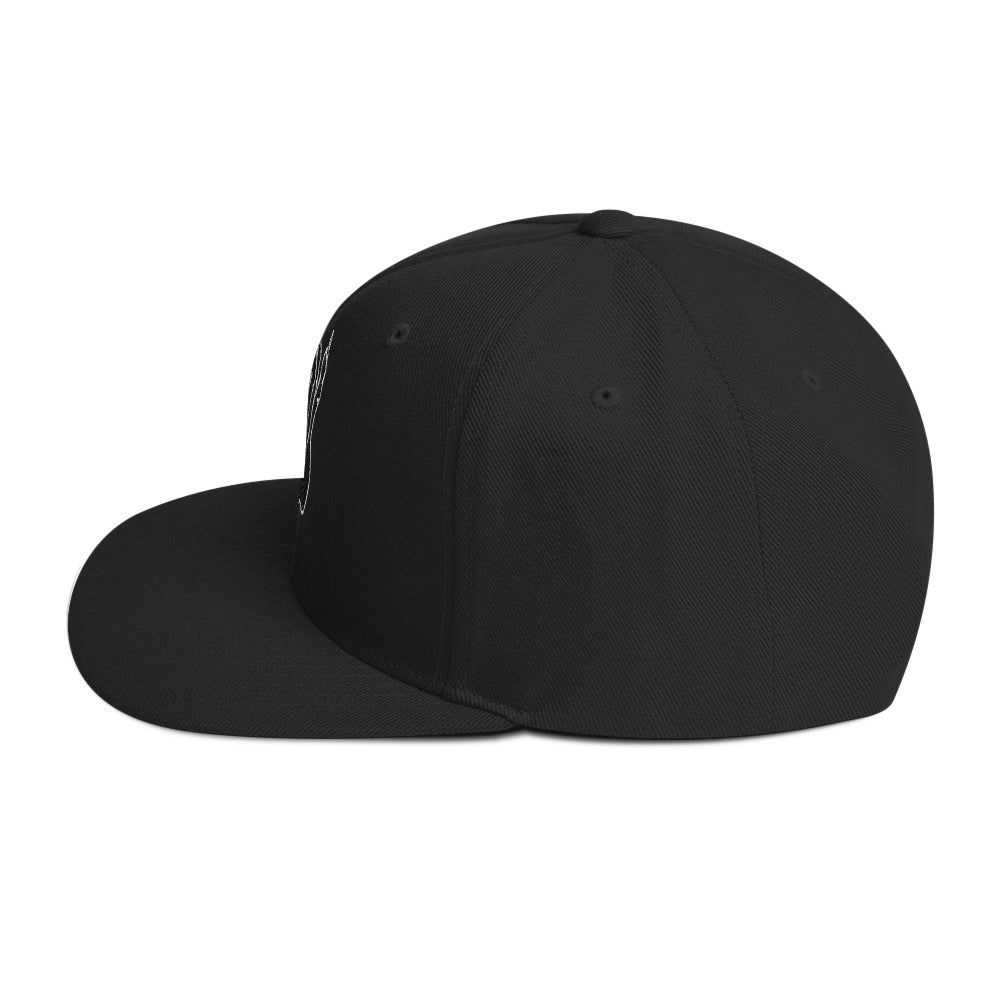 Left side view of the Hellbeing skull embroidered classic black on black snapback hat