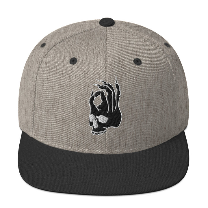 Hellbeing skull gray and black snapback cap, front design detail
