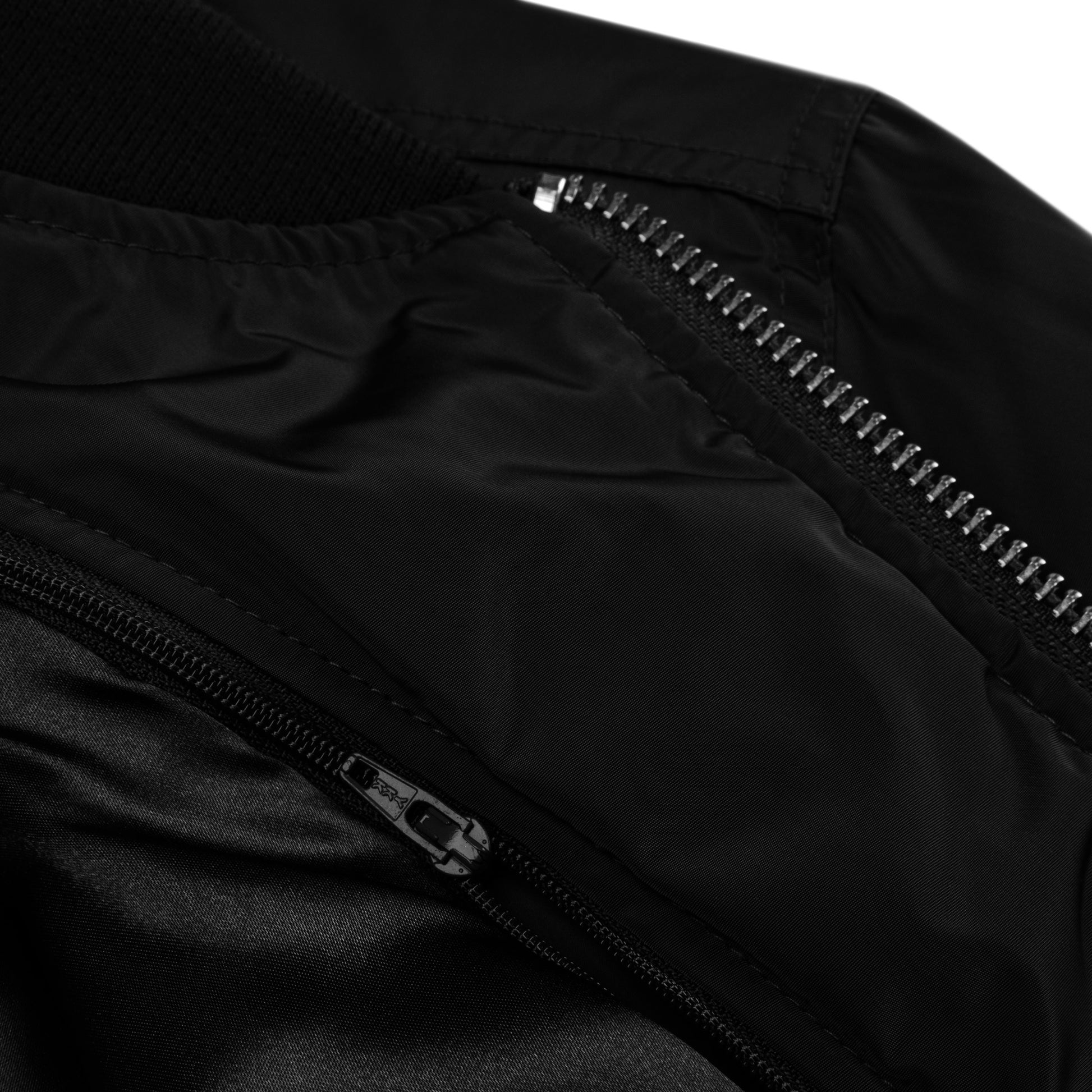 Zoomed in detail view of the Hellbeing premium recycled bomber jacket in black