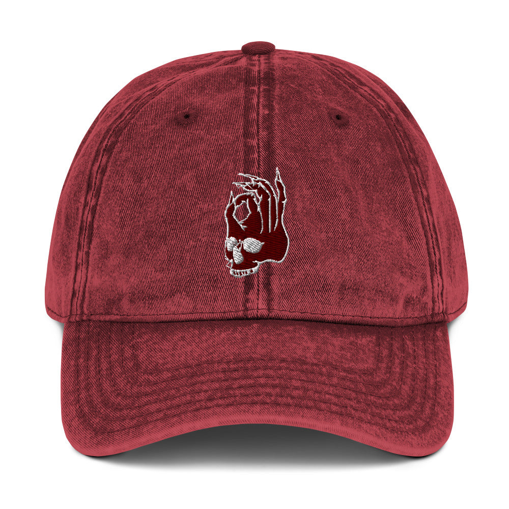 Front view of the Hellbeing skull embroidered vintage burgundy cap