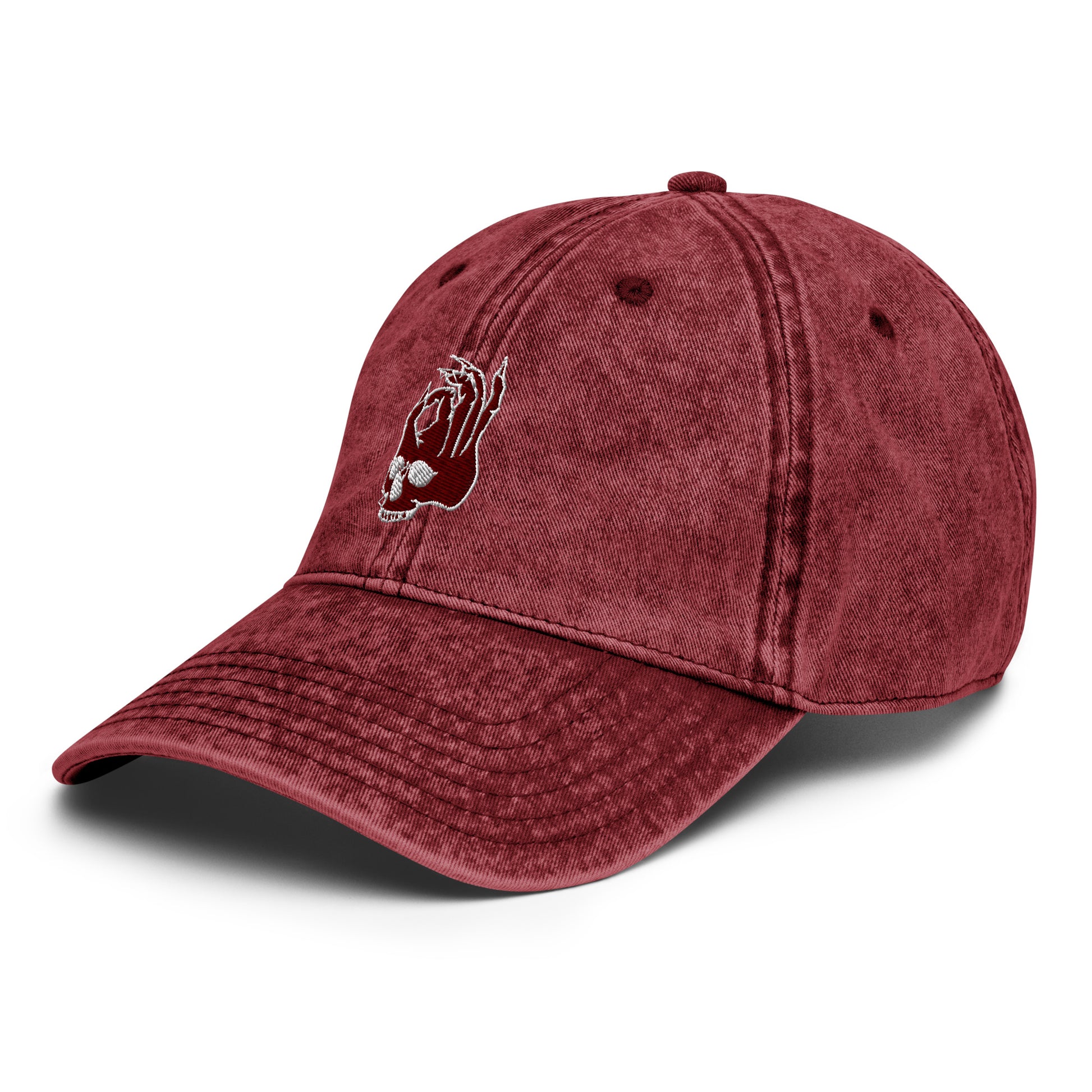 Front left view of the Hellbeing skull embroidered vintage burgundy cap