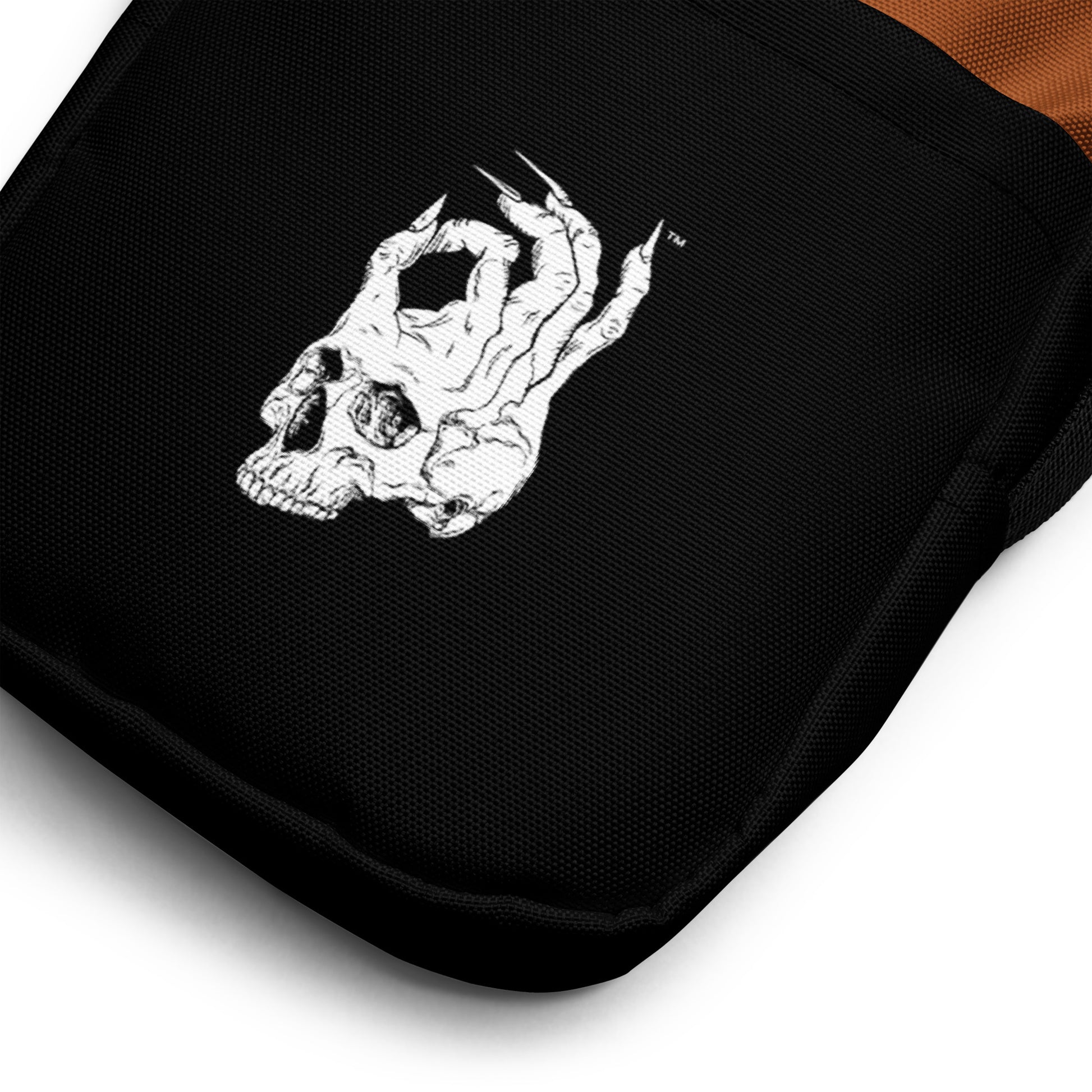 Zoomed in view of Hellbeing Brown and Black Crossbody utility bag