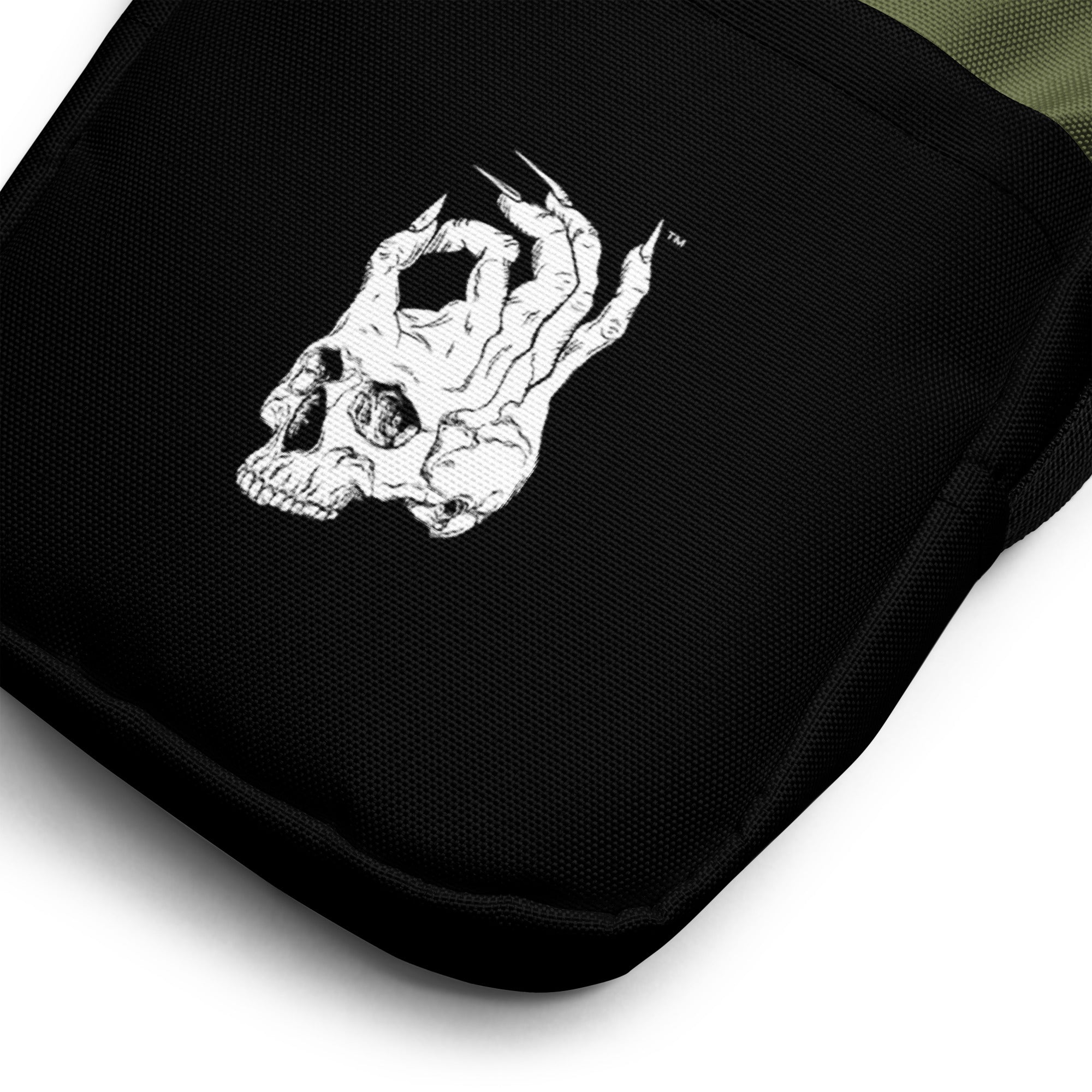 Hellbeing green and black utility crossbody bag, front pocket detail