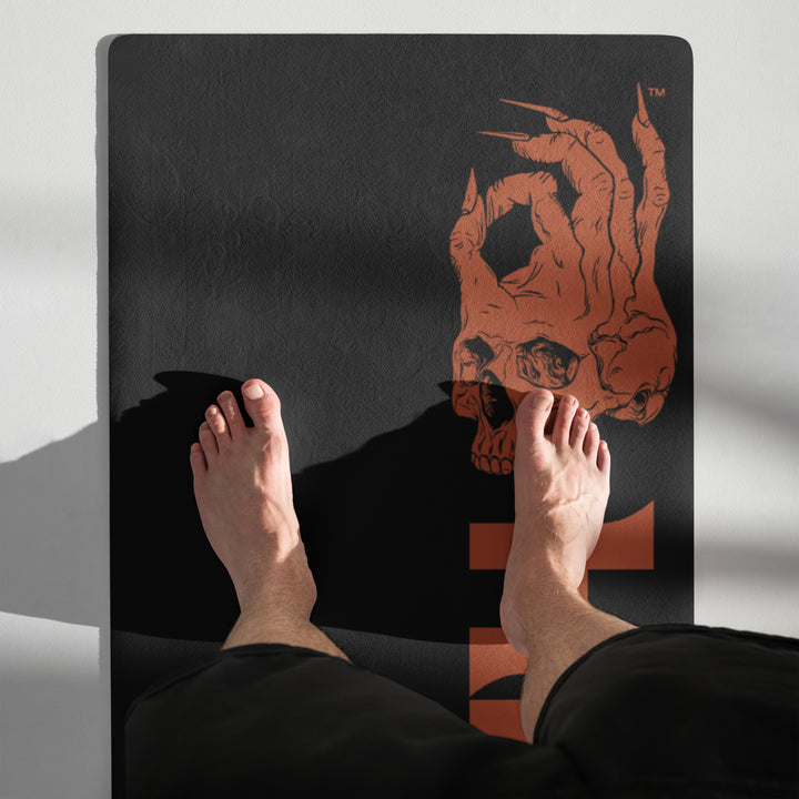 Hellbeing skull logo yoga mat, standing rolled view