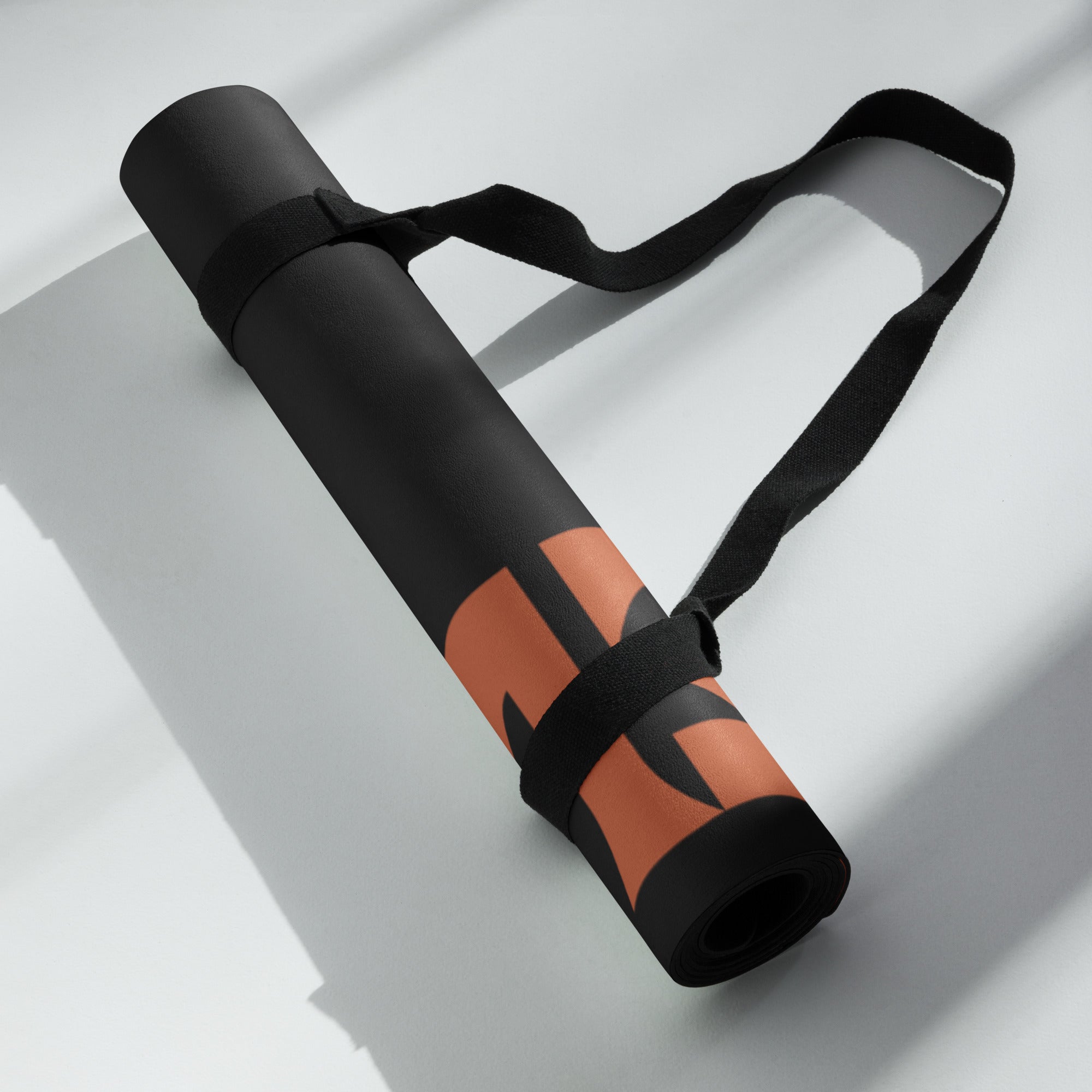 Hellbeing skull logo yoga mat, rolled, alternate angle