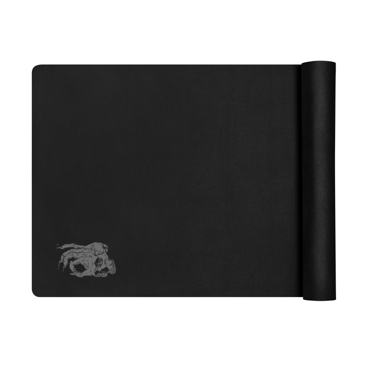 Hellbeing solid black yoga and exercise mat with gray skull logo in the corner, product photo 2 of 7