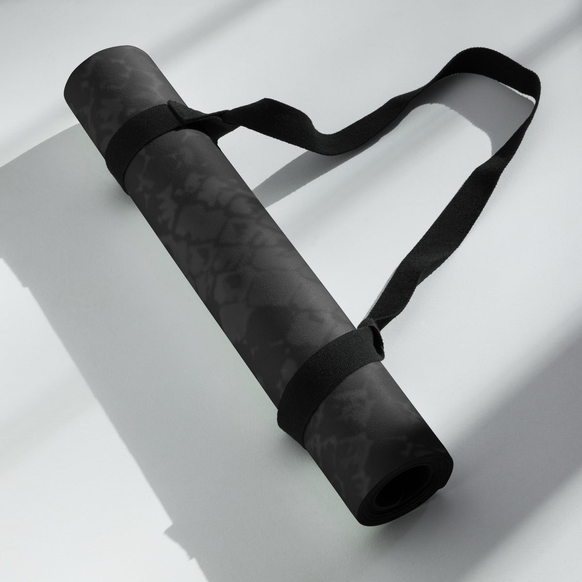 Hellbeing black snakeskin print yoga and exercise mat with skull logo in the corner, product photo 6 of 7