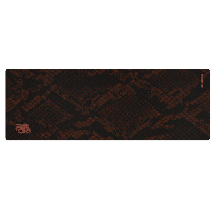 Hellbeing burgundy snakeskin print yoga and exercise mat with rust-red skull logo in the corner, product photo 1 of 6