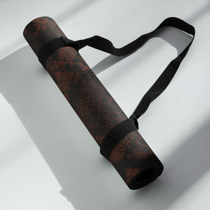 Hellbeing burgundy snakeskin print yoga and exercise mat with rust-red skull logo in the corner, product photo 5 of 6